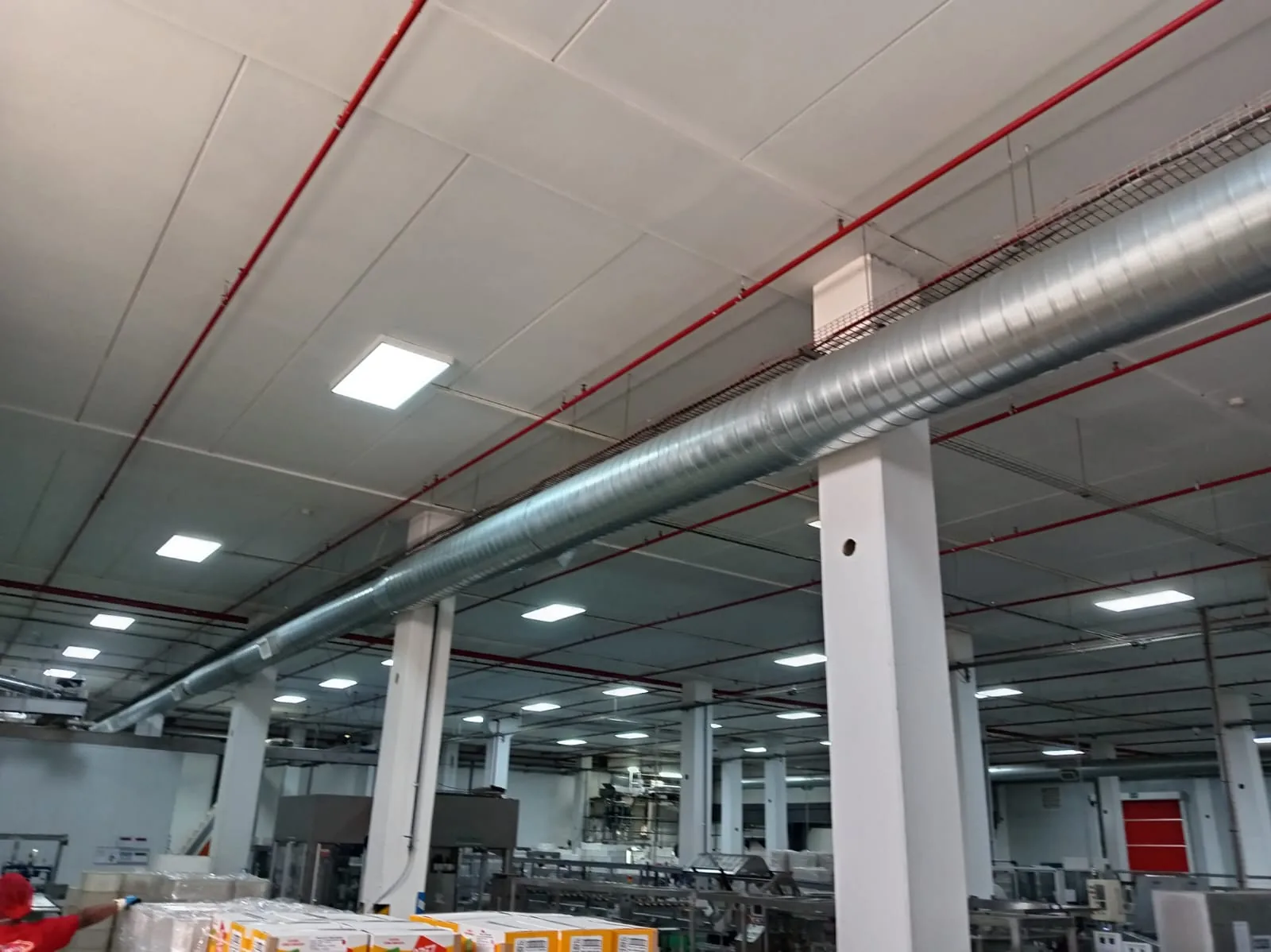 Large ventilation duct running above a production area