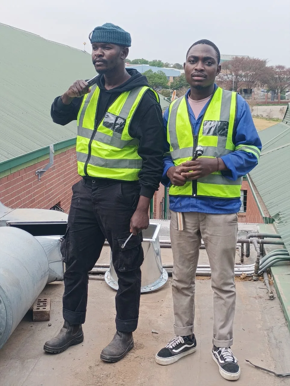Durban Appliance Repair technicians working with rooftop ventilation ducting