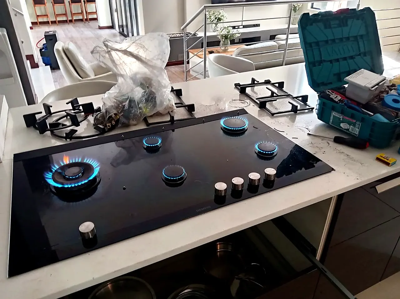 Gas hob with service tools during repair