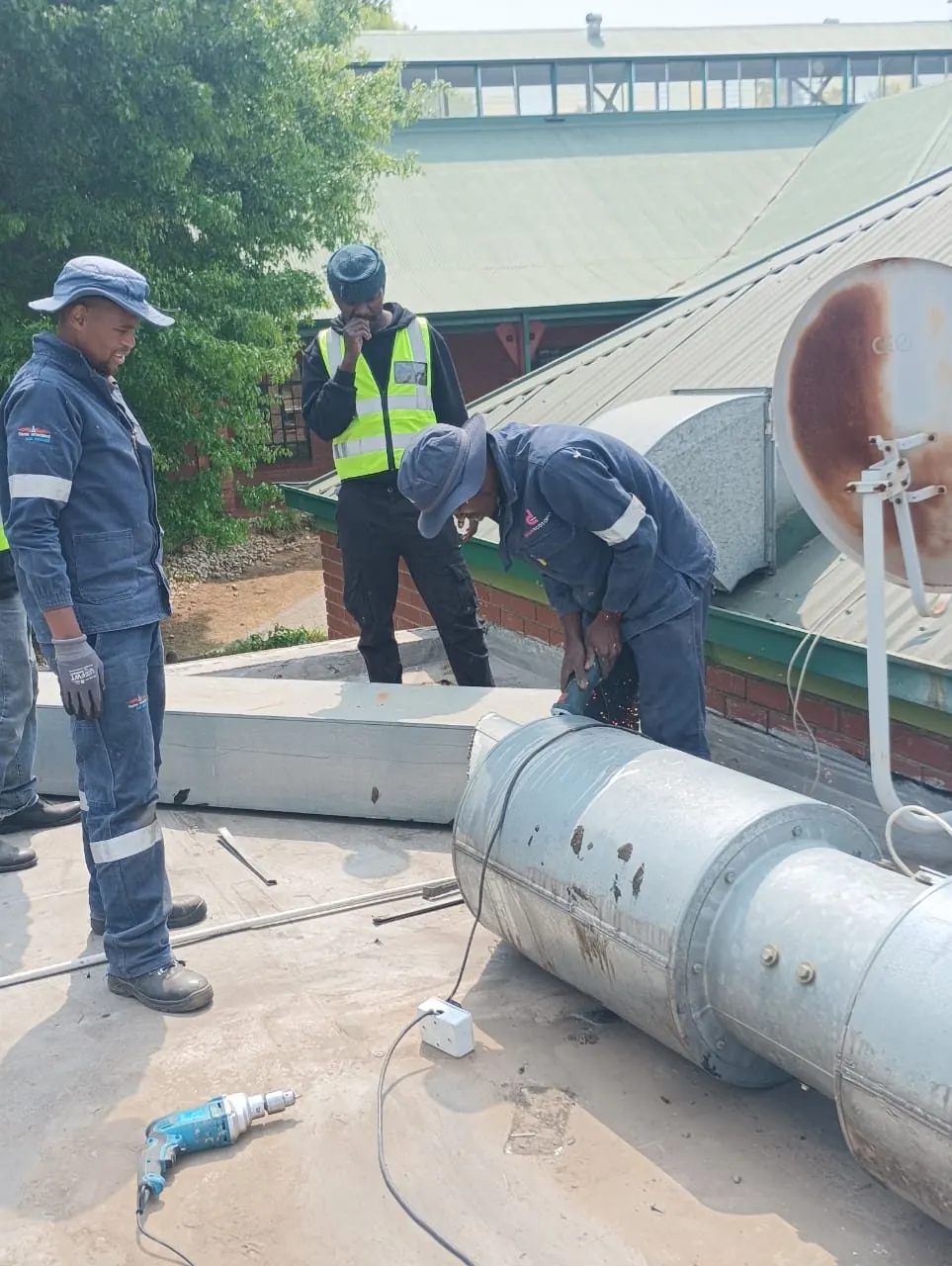 Technicians carrying out HVAC work