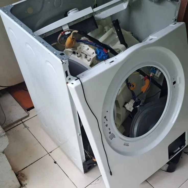 Open washing machine during repair